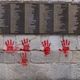 Des tags de "mains rouges" visibles sur le "Mur des Justes", le 14 mai 2024.