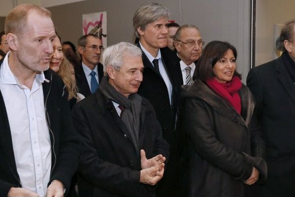 Olivier Berthe (premier plan), Président des Restaurants du Coeur et Stéphane Le Foll Ministre de l'agriculture à l'ouverture de la 29ème campagne, dans un centre d'accueil
des Restos à Paris.