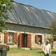 Plusieurs toitures sont recouvertes d'une bâche, le 18 juillet 2024, en Corrèze.
