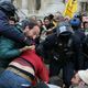 5 agriculteurs interpellés à Paris devant la Bourse du commerce par les forces de l'ordre. En rouge, au sol, un agriculteur de Haute-Saône membre de la Confédération paysanne.