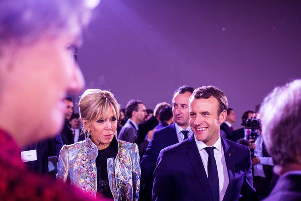 (Archives décembre 2012). Emmanuel et Brigitte Macron lors du dîner organisé par l'envoyé spécial auprès du Secrétaire général des Nations unies pour les villes et le changement climatique dans le cadre du One Planet Summit au Grand Palais. 