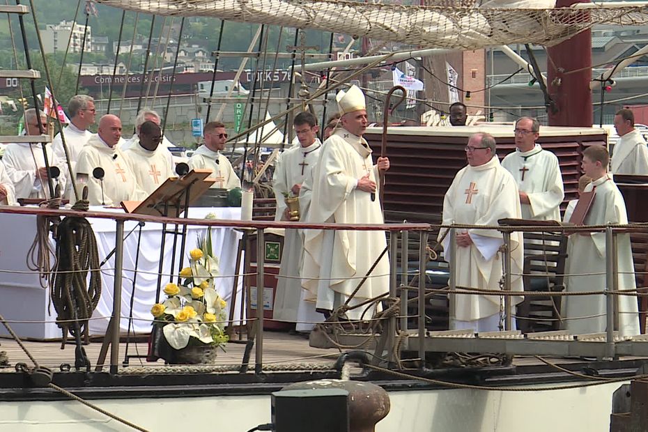 Archbishop of Rouen presides over traditional Armada mass for sailors on board boat Atlantis