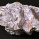 Granit de Beauvoir faciès pegmatitiques. Minéral lithinifère (qui porte le lithium) appelé Lépidolite