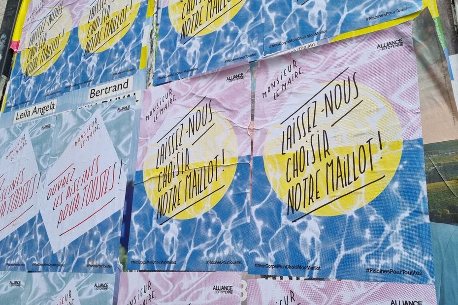 pro-burkini posters plastered on the Jean-Bron swimming pool