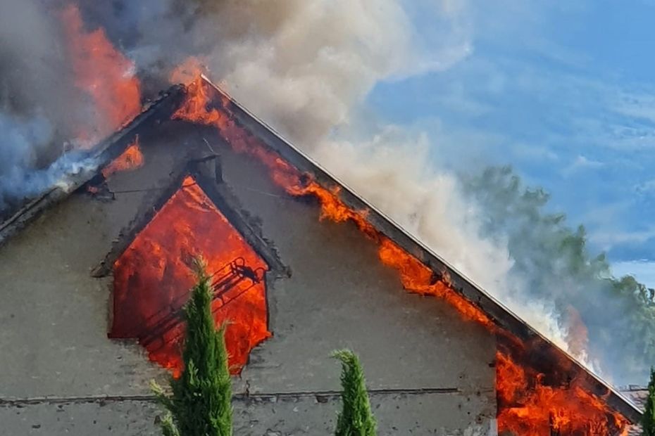 a stock of hay in flames in an old farmhouse, around thirty firefighters mobilized