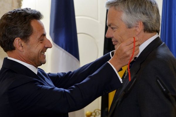 Nicolas Sarkozy et Didier Reynders, ministre des finances en Belgique. 