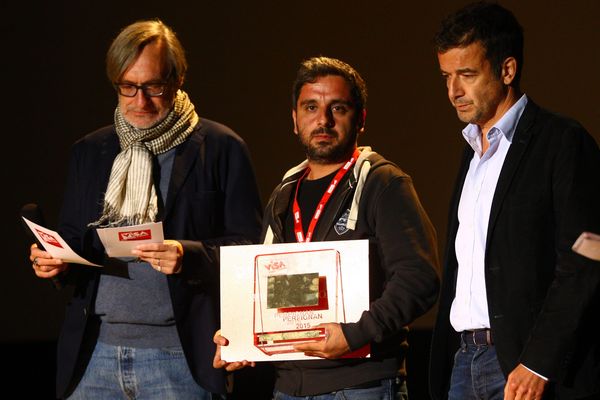 Le photographe turc Bulent Kiliç reçoit le prix Visa d'or news à Perpignan pour son reportage sur les réfugiés syriens à la frontière turque.