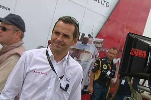 Benoit Tréluyer, le pilote bas-normand de l'écurie Audi, dans les allées du circuit des 24 heures du Mans, jeudi 20 juin 2013