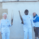 Passage de la flamme olympique entre Basile Boli, premier relayeur et Colette Cataldo, fidèle supportrice de l'OM, à Notre-Dame de la Garde, à Marseille.