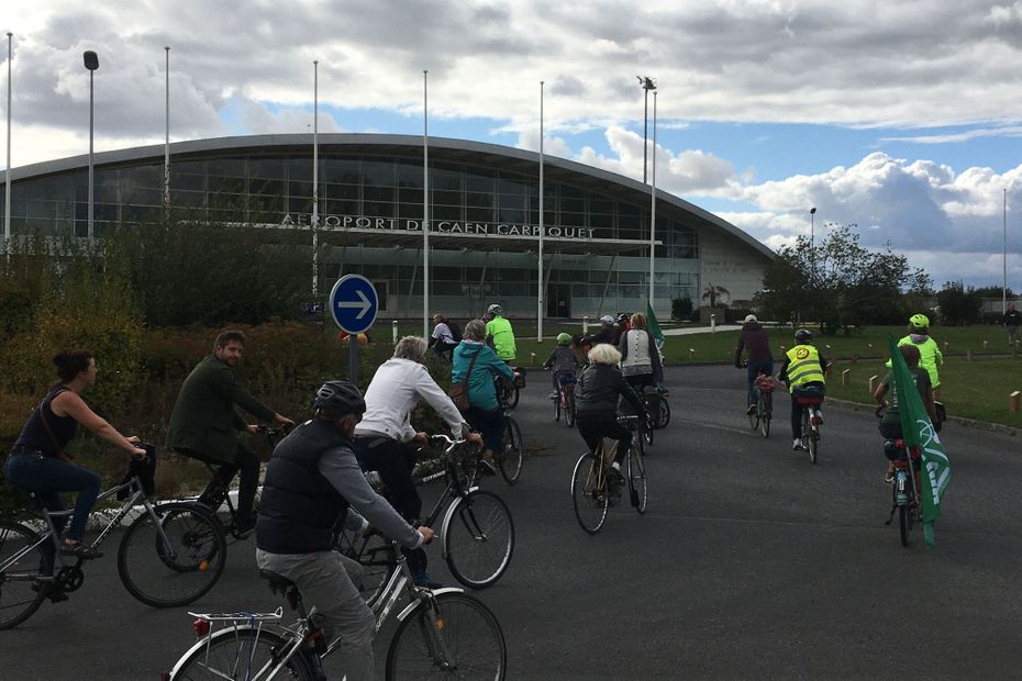 Pro-bike activists demonstrate against the lengthening of the runway at Caen-Carpiquet airport and air traffic