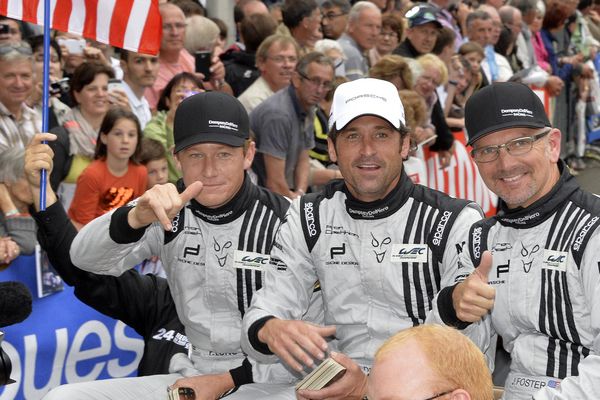 Parade des pilotes dans les rues du Mans, le 21 juin 2013. L'équipage américain de la Porsche n°77 Avec Patrick Long, Patrick Dempsey et Joe Foster.